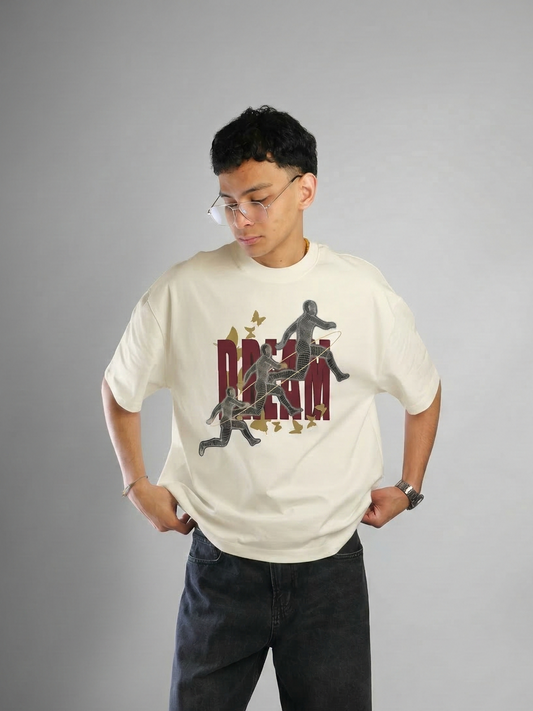 Person wearing a white t-shirt with graphic design on a gray background